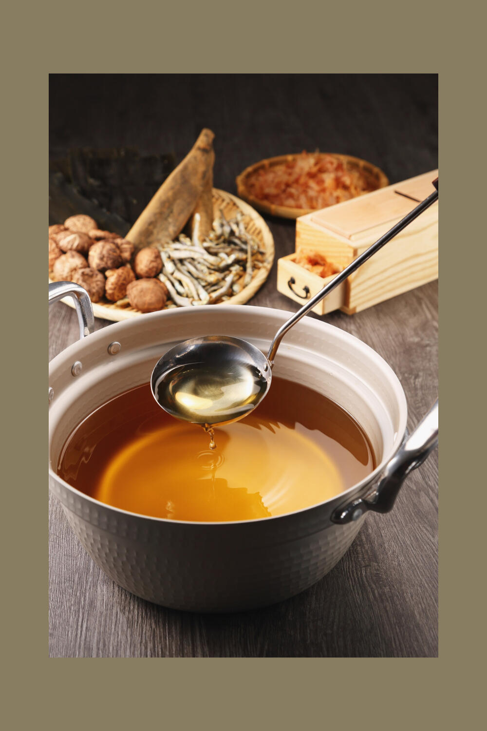 clear bone broth is shown with ladel